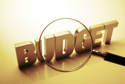 Budget with a magnifying glass
