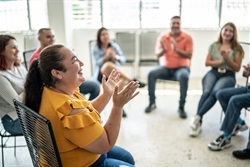 Adult Woman Applauding during a presentation