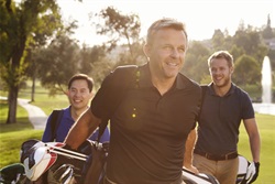 Men Golfing and Smiling