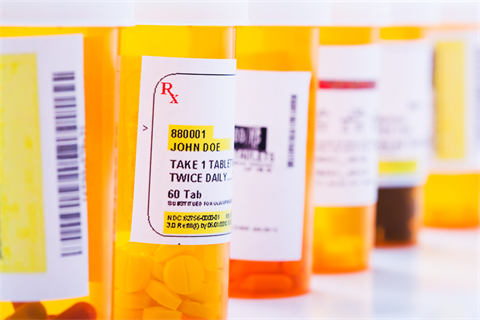 A row of orange pill bottles