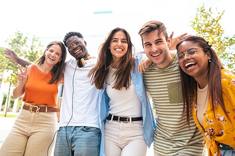 Five teenagers smiling
