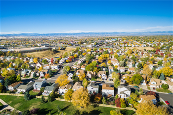 Aerial view of a neighborhood with mountain ridge in the far distance