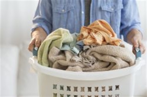 Person holding a laundry basket