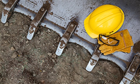 A construction hat sitting on a bulldozer