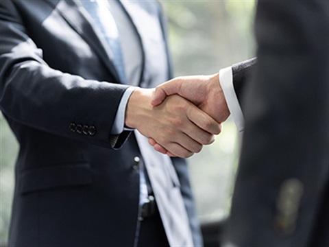 Two businessmen shaking hands