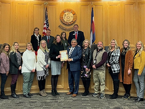 Members of Weld County's adoption team with the Weld County Board of Commissioners.
