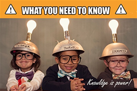 Three kids smiling with lightbulbs attached to their heads.