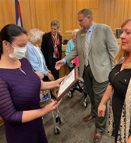 Commissioner James shaking residents' hands at board meetingesentation with GardenSquareGreeley_003.jpg