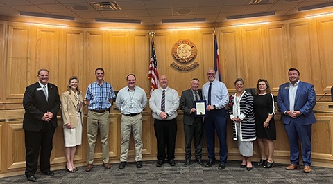 Office of Emergency Management Staff standing with the Weld County Board of Commissioners.