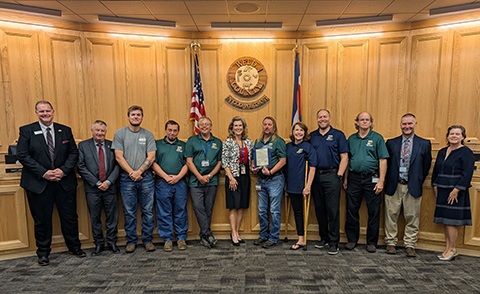 Weld County Household Hazardous Waste staff with the board of commissioners