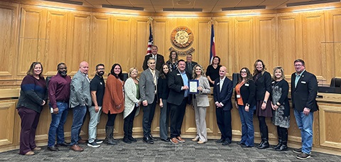 Weld County Human Services staff with the board of commissioners