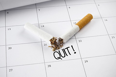 A broken cigarette sits on Nov. 21 calendar date. 