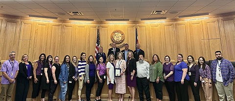 weld county board of commissioners standing with area agency on aging staff