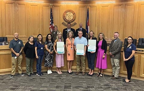 NACo award recipients with the board of commissioners