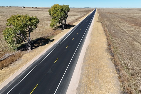 An aerial view of a finished portion of Weld County Road 77 between Weld County Road 106 and Weld County Road 114.