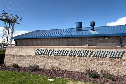 The Greeley-Weld Airport sign at the front of the airport.