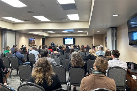 Attendees listen to a speaker during the Northern Colorado Workforce Symposium
